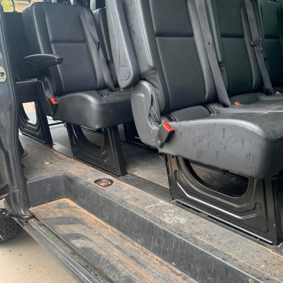A work van bench seat part-way through an interior clean